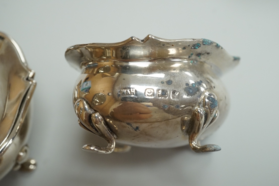 A George V eight piece silver cruet set by Walker & Hall, Birmingham, 1923, lacking spoons.